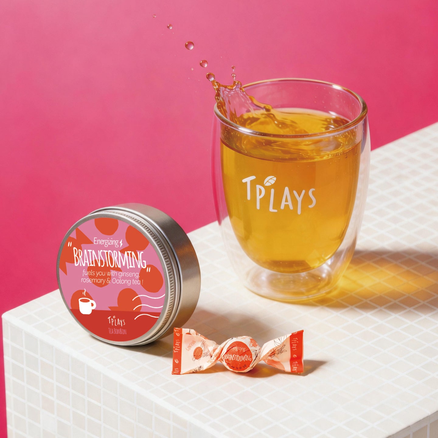 Tea Bonbon Energizing Brainstorming tin with brewed black tea glass